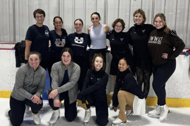 The Figure skating club poses at the rink for a group photo