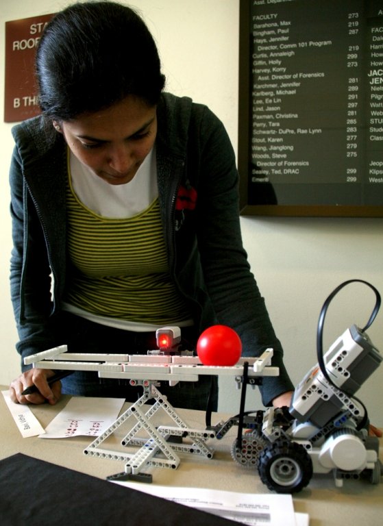 WWU student Vidhya Bavi works on her robot during the student robot competition in the Communications Facility on Thursday, June 3. Bavi's "Seesaw Robot" tries to balance a ball by flipping the levers about the pivot point so that the ball does not roll o