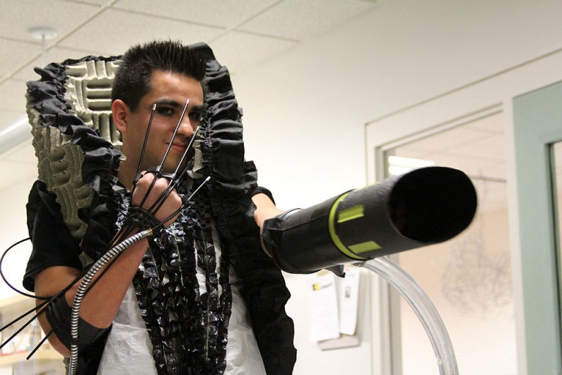 Daniel Galan, a sophomore in the industrial design program, dons a recycled super-villain costume. Photo by Becky Tachihara | University Communications intern