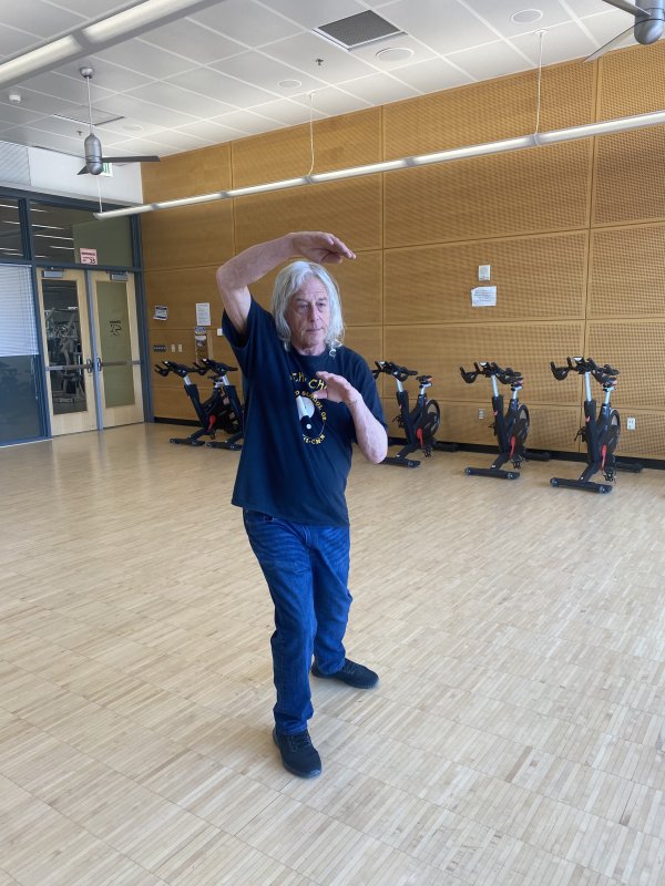 Gene Golden works through a series of moves while practicing Tai Chi in the student recreation center