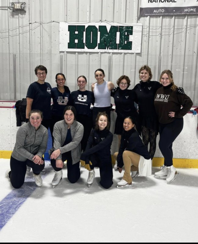 The Figure skating club poses at the rink for a group photo