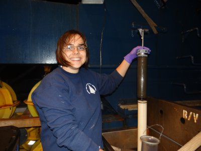 Karin Lemkau processing sediment cores collected by ROV Jason on the stern of the vessel 