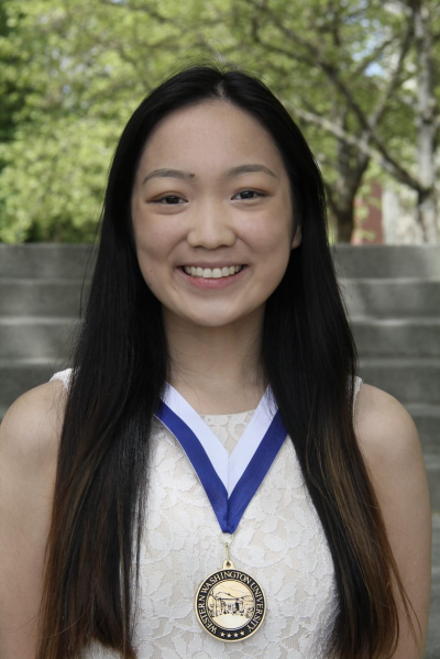 College of Science and Engineering Presidential Scholar Melody Gao wears her medal outdoors on Western's campus.