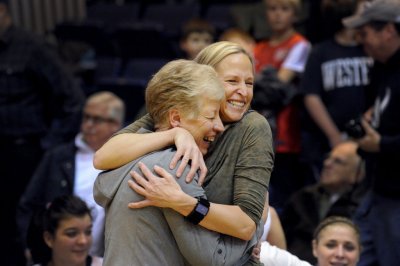 Lynda Goodrich, the WWU women's basketball coach from 1971 to 1990, hugs current coach Carmen Dolfo. Dolfo succeeded Goodrich as head coach in 1990. Courtesy photo