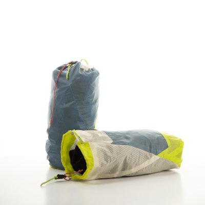 A pair of stuff sacks, one blue and the other blue and yellow, made by Keith Forsythe