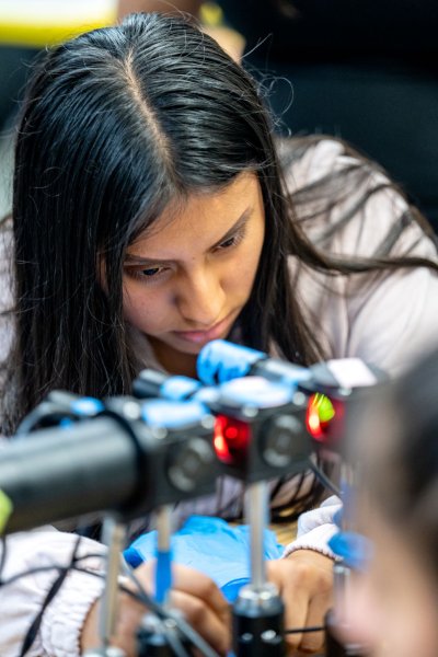 Mount Vernon High School student Gladys Gonzalez focuses as she puts together a piece of a microscope.