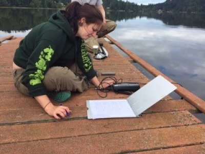 Holly Young records data collected at Lake Erie in Anacortes on Monday, July 13, 2015. Photo by Tayler Blumenfeld / WWU Communications and Marketing intern