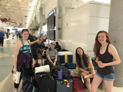 Western's student researchers wait with their gear at the airport