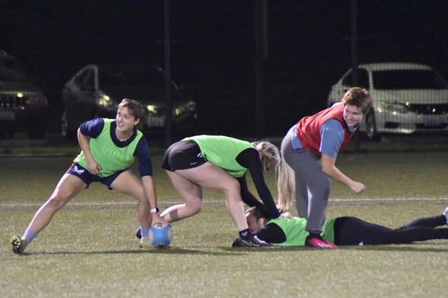 Sydney practicing with teammates at Harrington Field