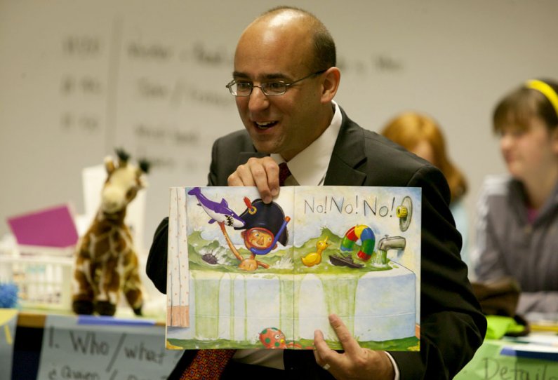 Greg Baker, who started July 1 as the new superintendent for the Bellingham School District, reads the book "No, David!" to schoolchildren taking part in the Western Kids Camp in the Environmental Studies Building. Baker, a WWU alumnus, read a couple of b