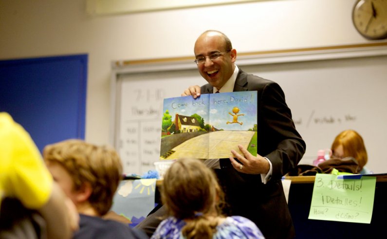 Greg Baker, who started July 1 as the new superintendent for the Bellingham School District, reads the book "No, David!" to schoolchildren taking part in the Western Kids Camp in the Environmental Studies Building. Baker, a WWU alumnus, read a couple of b