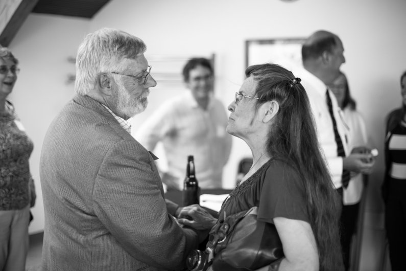 John Lawson chats with his wife during a retirement celebration in his honor on June 30, 2016. Lawson is retiring as Western's chief information officer. Photo by Jonathan Williams / WWU