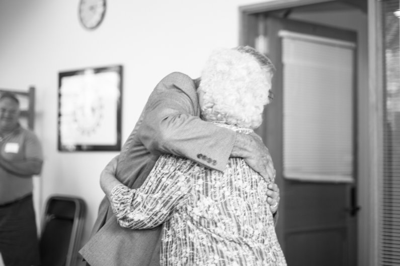 John Lawson hugs his mother after she spoke a few words at his retirement celebration June 30, 2016, at Western Washington University. Lawson is retiring as Western's CIO. Photo by Jonathan Williams / WWU