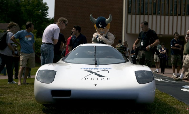 Victor Viking, WWU's mascot, takes a look at Viking 45 during a recognition celebration for the WWU X PRIZE Team on Thursday, Aug. 5.