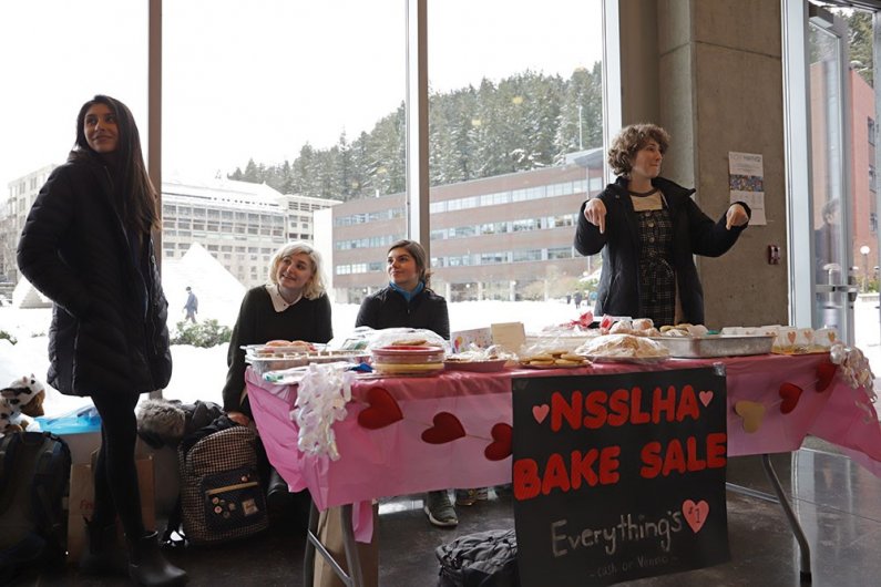 Seniors Sophie Parody, Bianca Garza, Morgan Spargo and Shevidan Drew run a Valentine's Day bake sale in Academic West to raise money for the National Speech Language and Hearing Association (NSSHLA) club on Thursday, Feb. 14. 