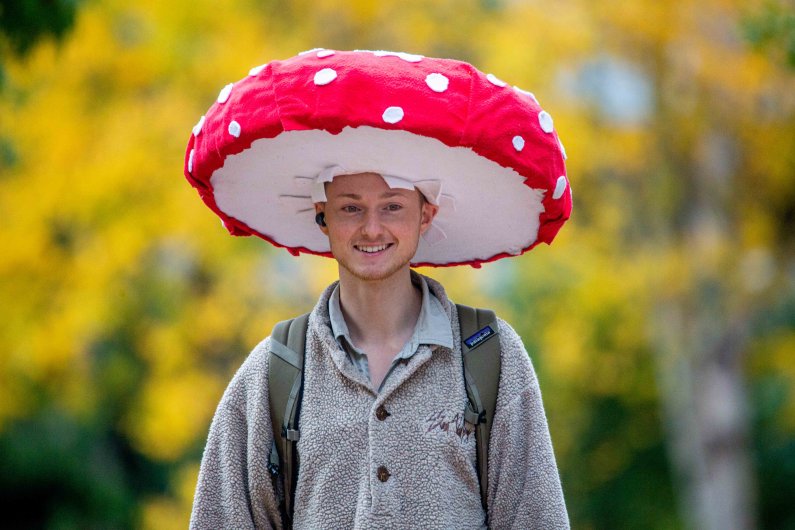 Man wearing a toadstool hat