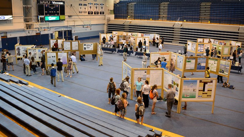 Students display research posters in Sam Carver Gymnasium on May 15. The All University Poster Session is from 10 a.m to 2 p.m on Thursday, May 15 and Friday May 16. The poster session is just one of the many events for Scholars Week, which include guest 