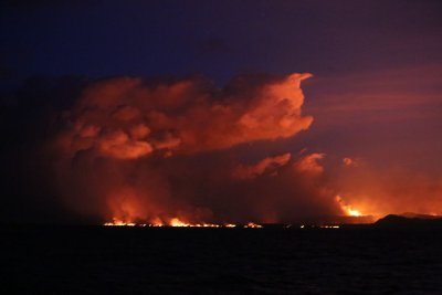 lava at night, from the sea